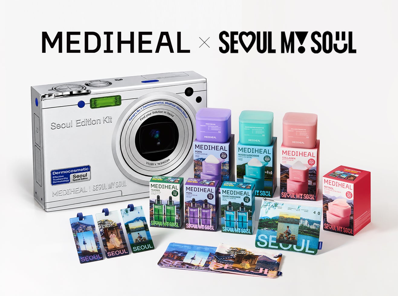 카메라 모양의 서울 에디션 키트 상자 옆에 보라색·청록색·분홍색 화장품 패키지와 서울 풍경을 담은 파우치·태그가 놓인 모습
