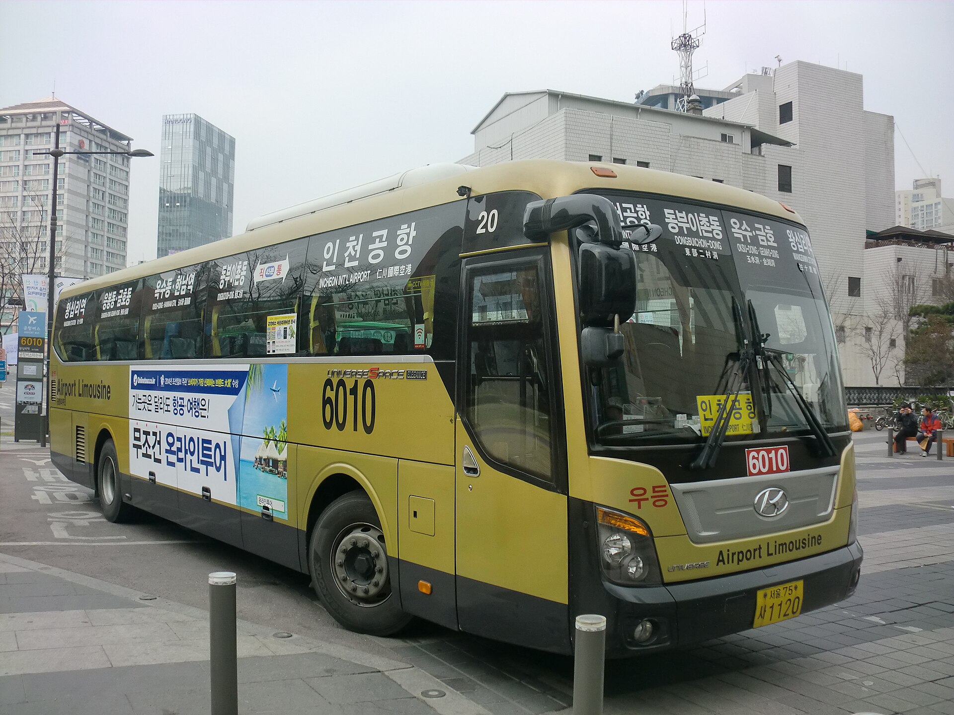 A yellow airport limousine bus marked Incheon Airport
